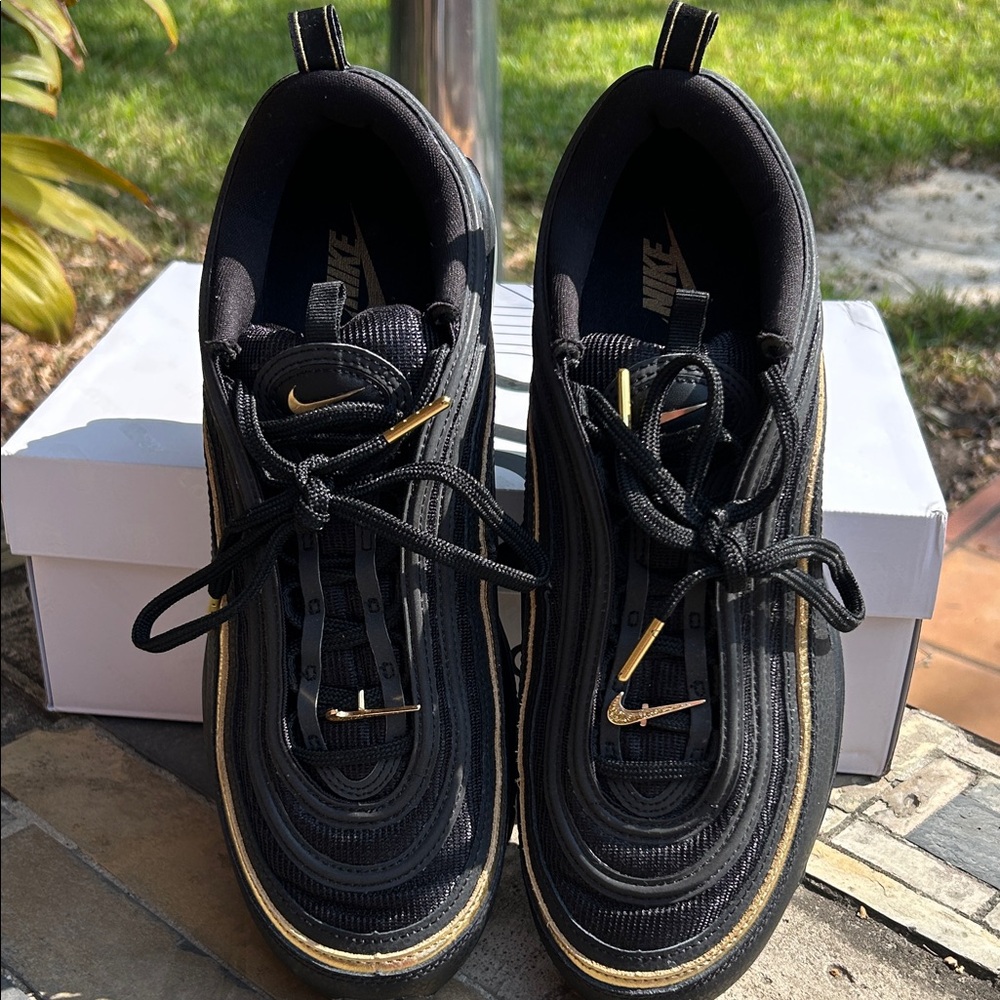 Nike Black Sneakers with Gold Highlights